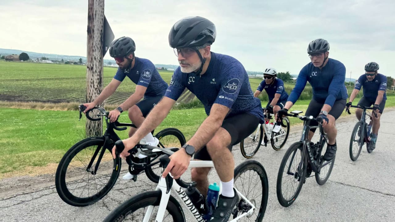 Jaffari Cycling Club members riding together on a country road