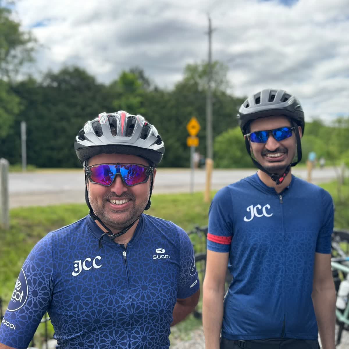 Two club members riding side by side