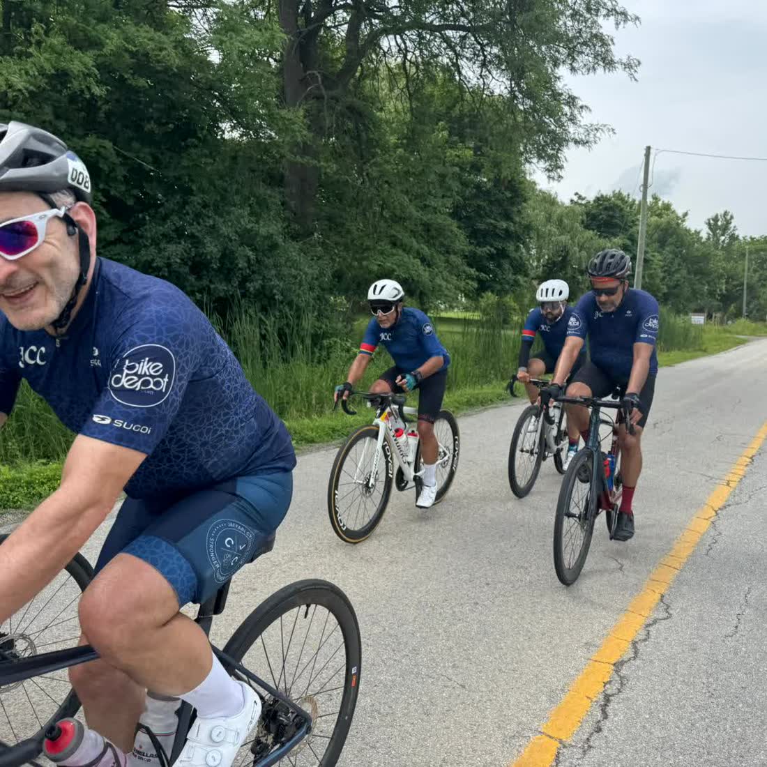 Two club members riding side by side